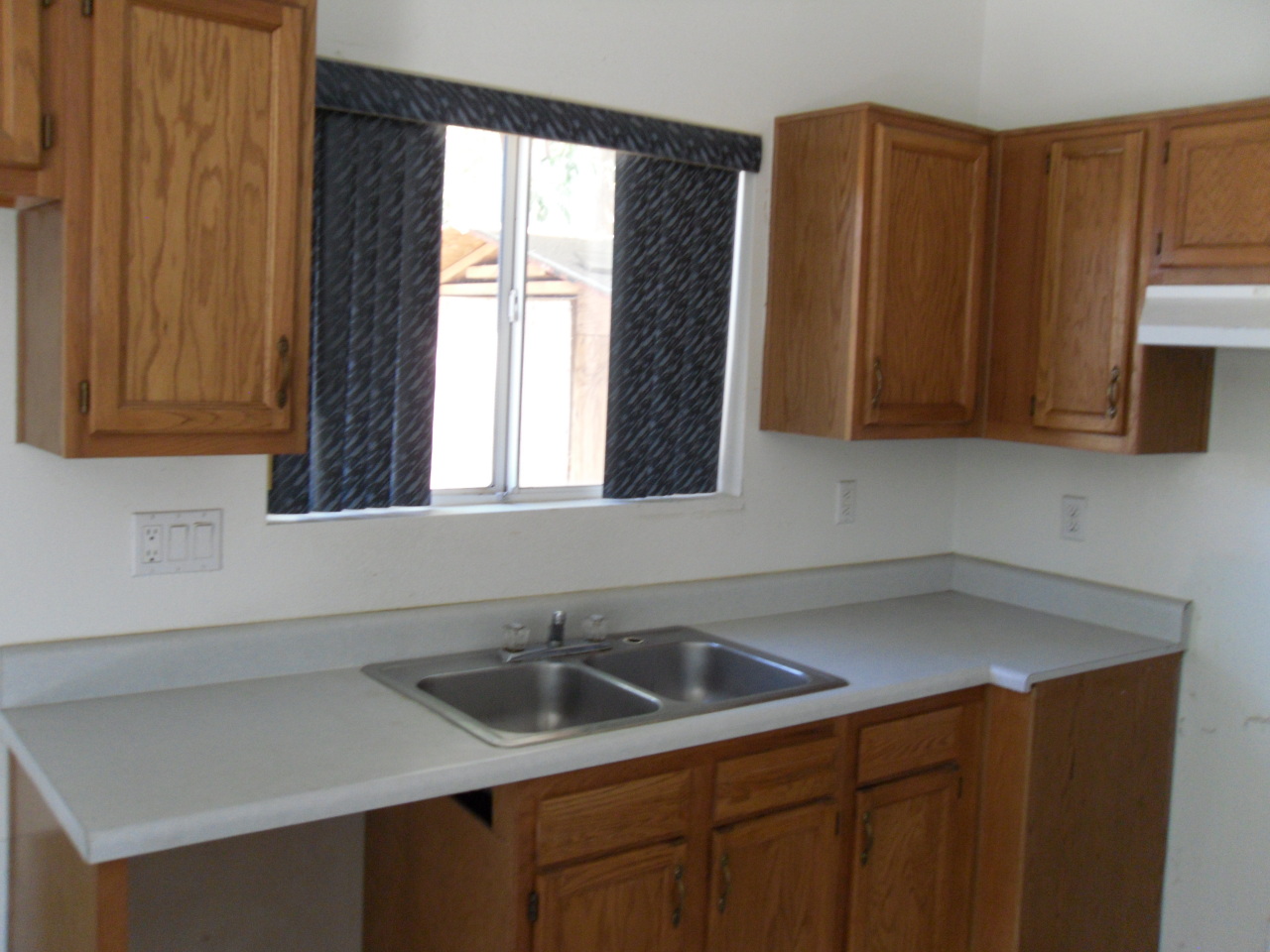 1431 East Carson Road Phoenix, AZ 85042 - Photo 8 of 25 a kitchen with a sink cabinets and a window