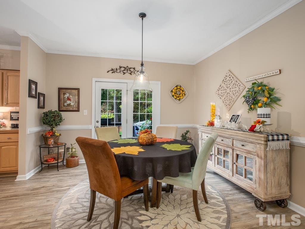 2525 Baptist Road Durham, NC 27703 - Photo 12 of 23 a view of a dining room with furniture window and wooden floor