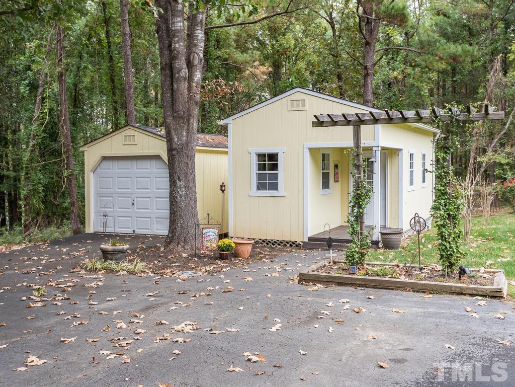 2525 Baptist Road Durham, NC 27703 - Photo 19 of 23 a front view of a house with a yard