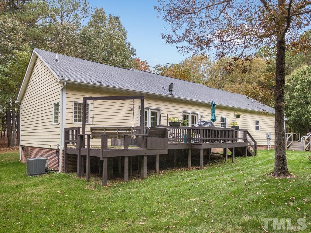 2525 Baptist Road Durham, NC 27703 - Photo 20 of 23 a backyard of a house with table and chairs