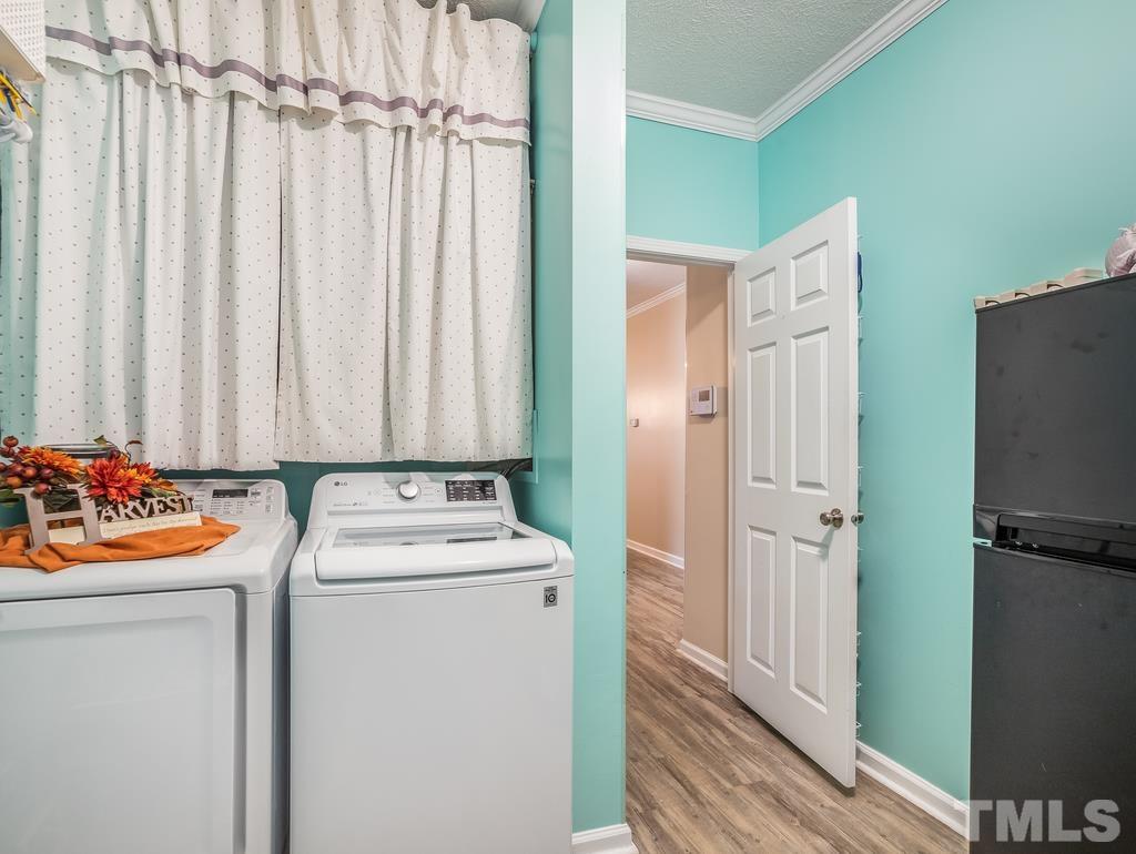 2525 Baptist Road Durham, NC 27703 - Photo 5 of 23 a view of walk in closet with clothes and shoes