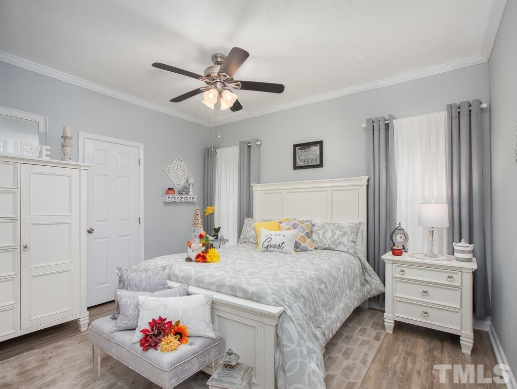 2525 Baptist Road Durham, NC 27703 - Photo 7 of 23 a bedroom with a bed and a closet