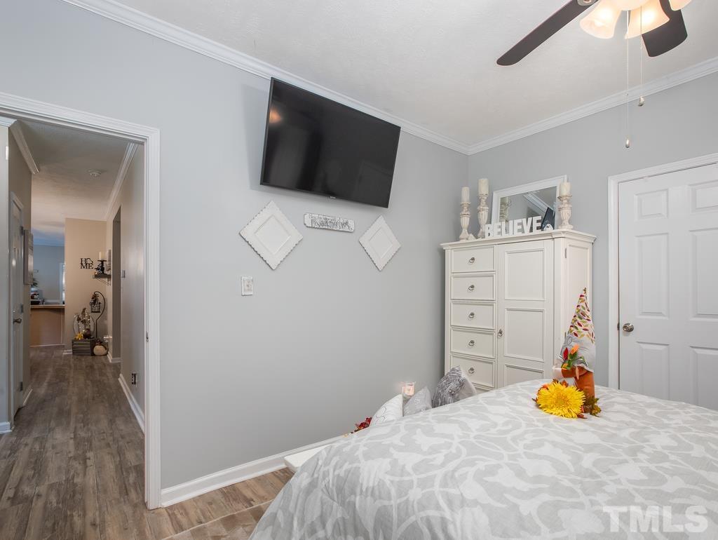 2525 Baptist Road Durham, NC 27703 - Photo 8 of 23 a bedroom with a bed and a flat screen tv