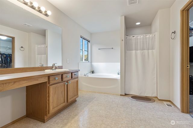 a bedroom with furniture and window