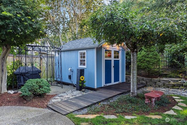 an aerial view of residential house with outdoor space and swimming pool