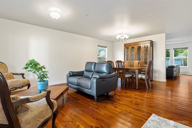a view of a dining room with furniture window and wooden floor