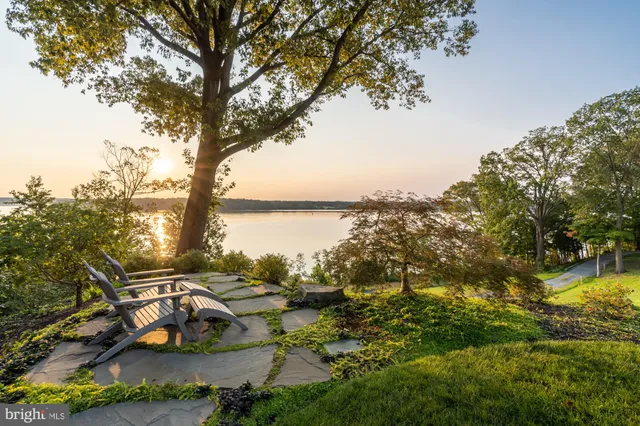 a view of a lake with houses in the back
