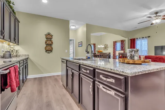 a bathroom with sink a mirror a vanity and shower