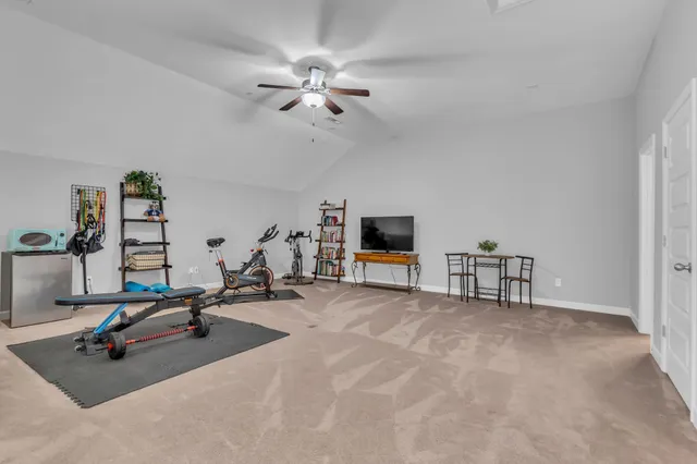 a view of a livingroom with furniture and a flat screen tv