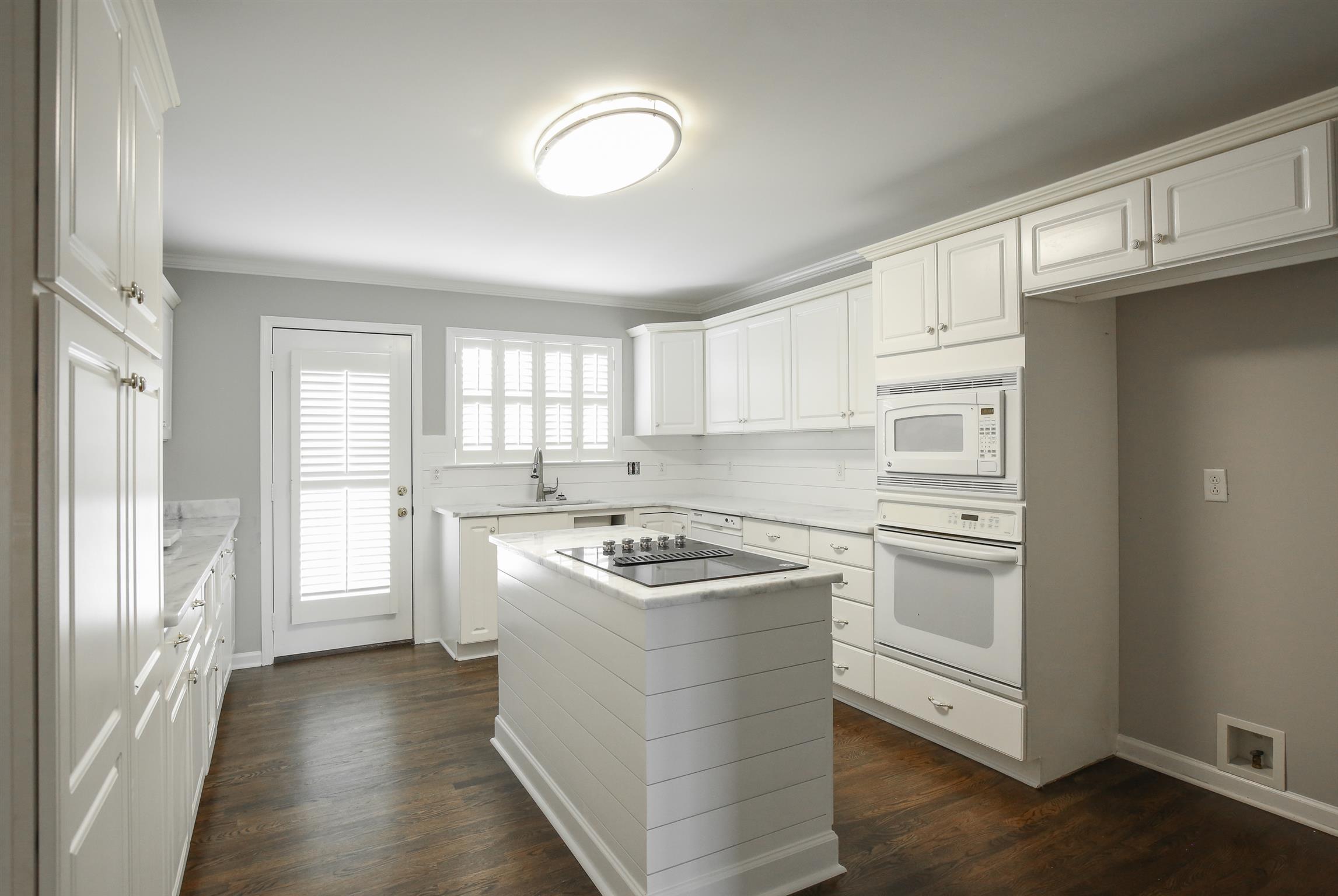 3411 East Compton Road Murfreesboro, TN 37130 - Photo 14 of 30 Kitchen with nickel gap shiplap around the island and backsplash