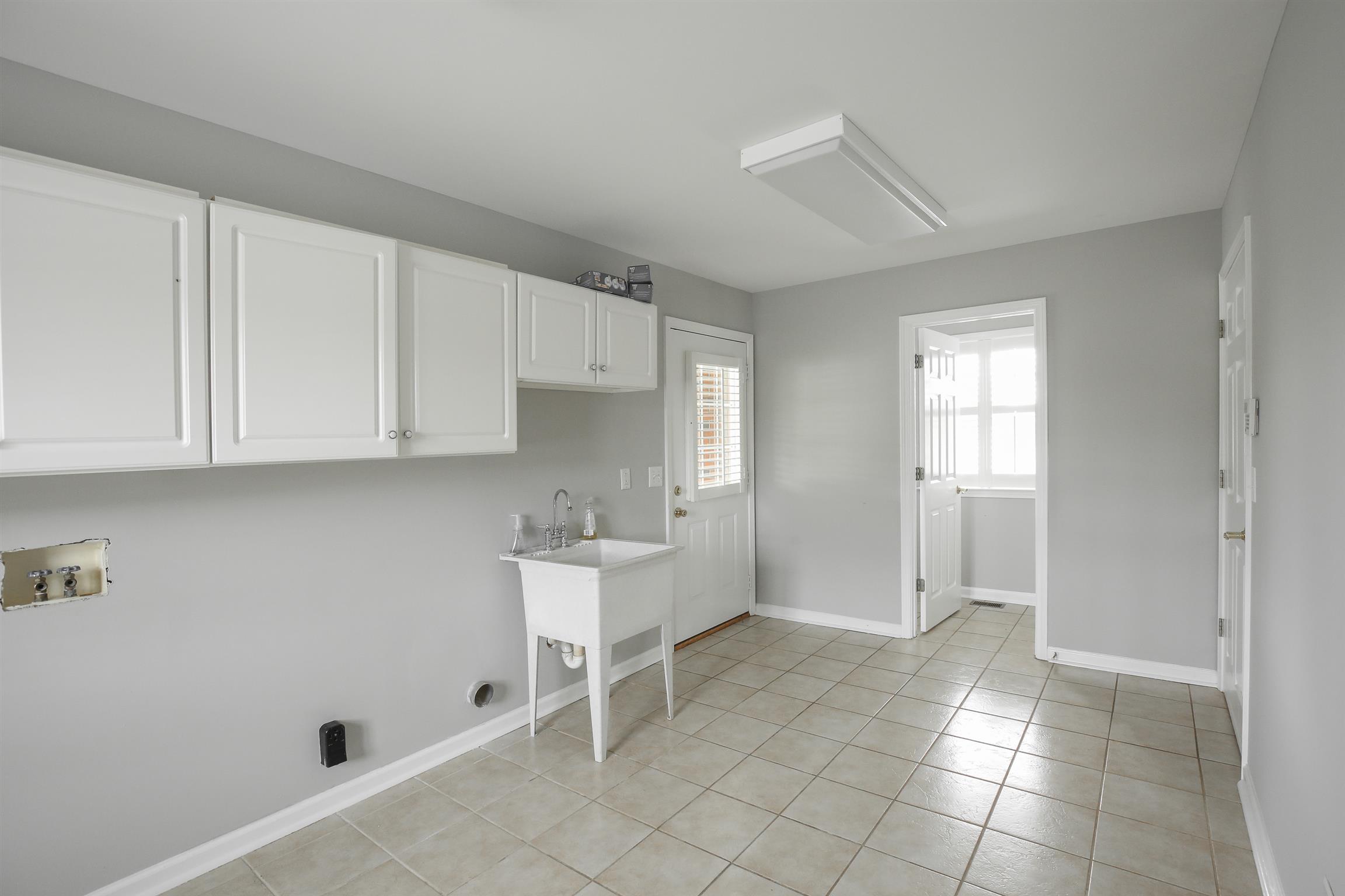 3411 East Compton Road Murfreesboro, TN 37130 - Photo 26 of 30 Mudd room/Laundry located right off the carport, features cabinets, sink and half bathroom