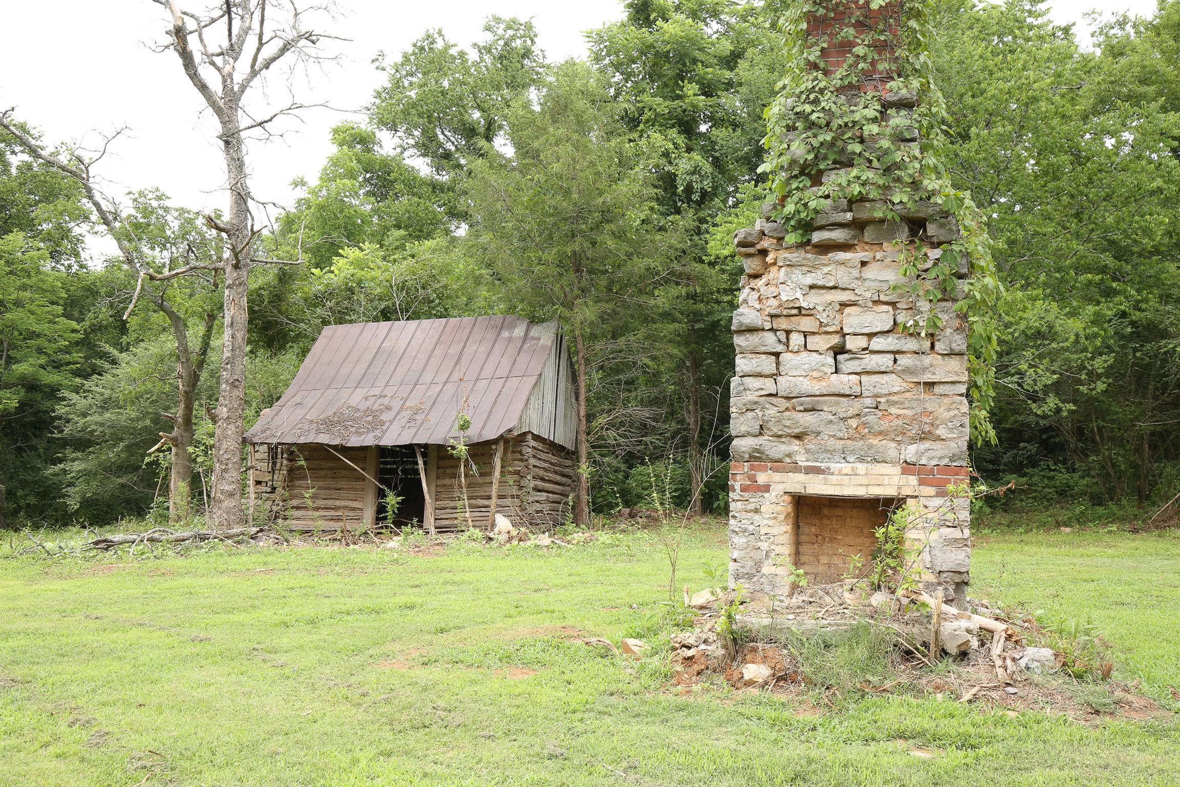 3411 East Compton Road Murfreesboro, TN 37130 - Photo 29 of 30 Original Log Cabin and Stone Chimney on Property is “AS IS” (Age is unknown, Buyer to verify at Buyers expense if important)
