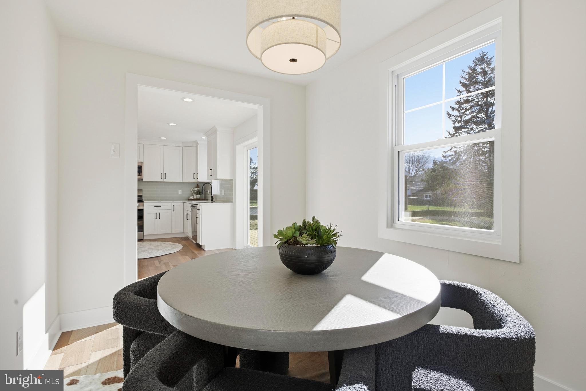 338 Wayne Avenue Springfield, PA 19064 - Photo 13 of 34 a view of a dining room with furniture and wooden floor