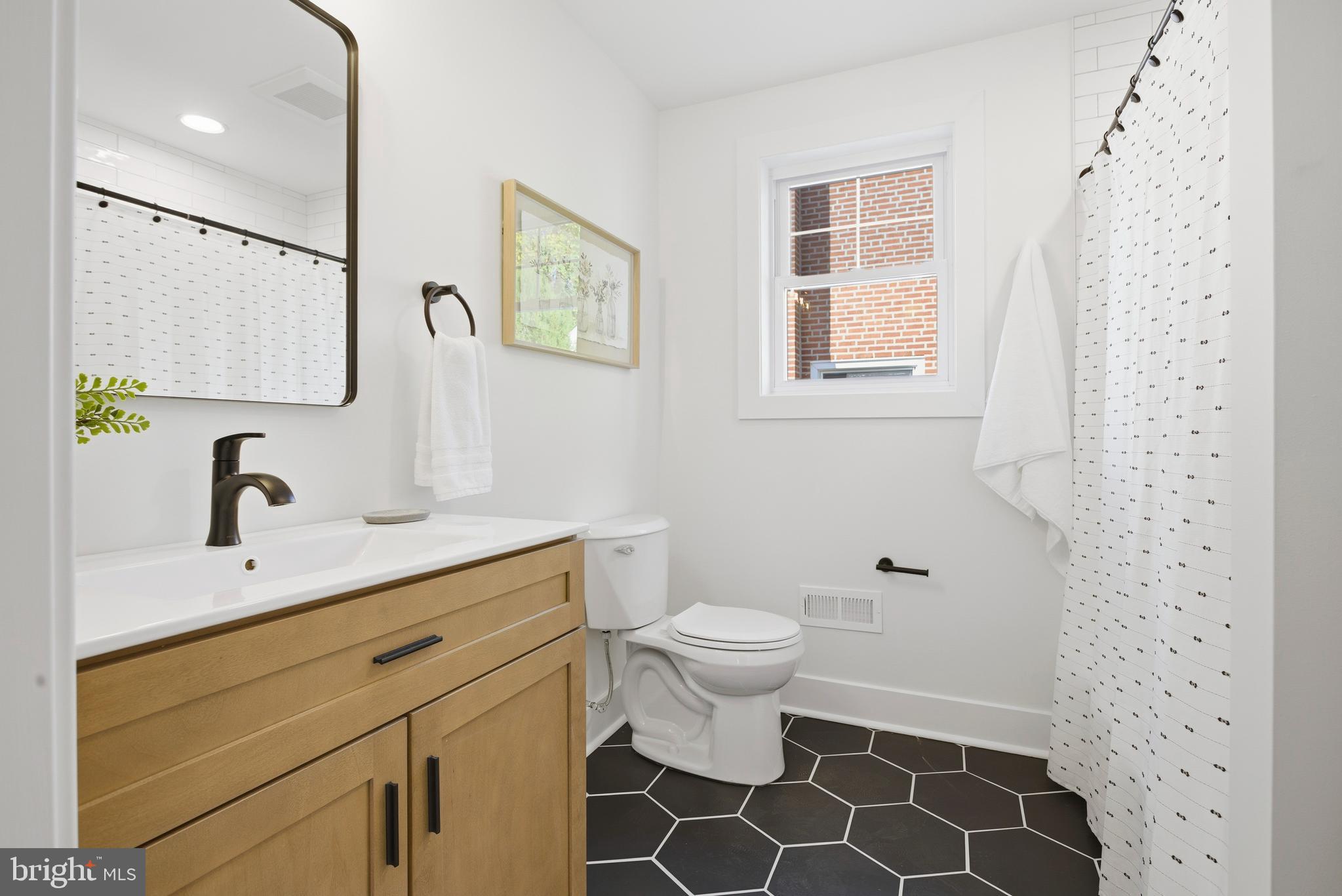 338 Wayne Avenue Springfield, PA 19064 - Photo 16 of 34 a bathroom with a sink toilet and shower
