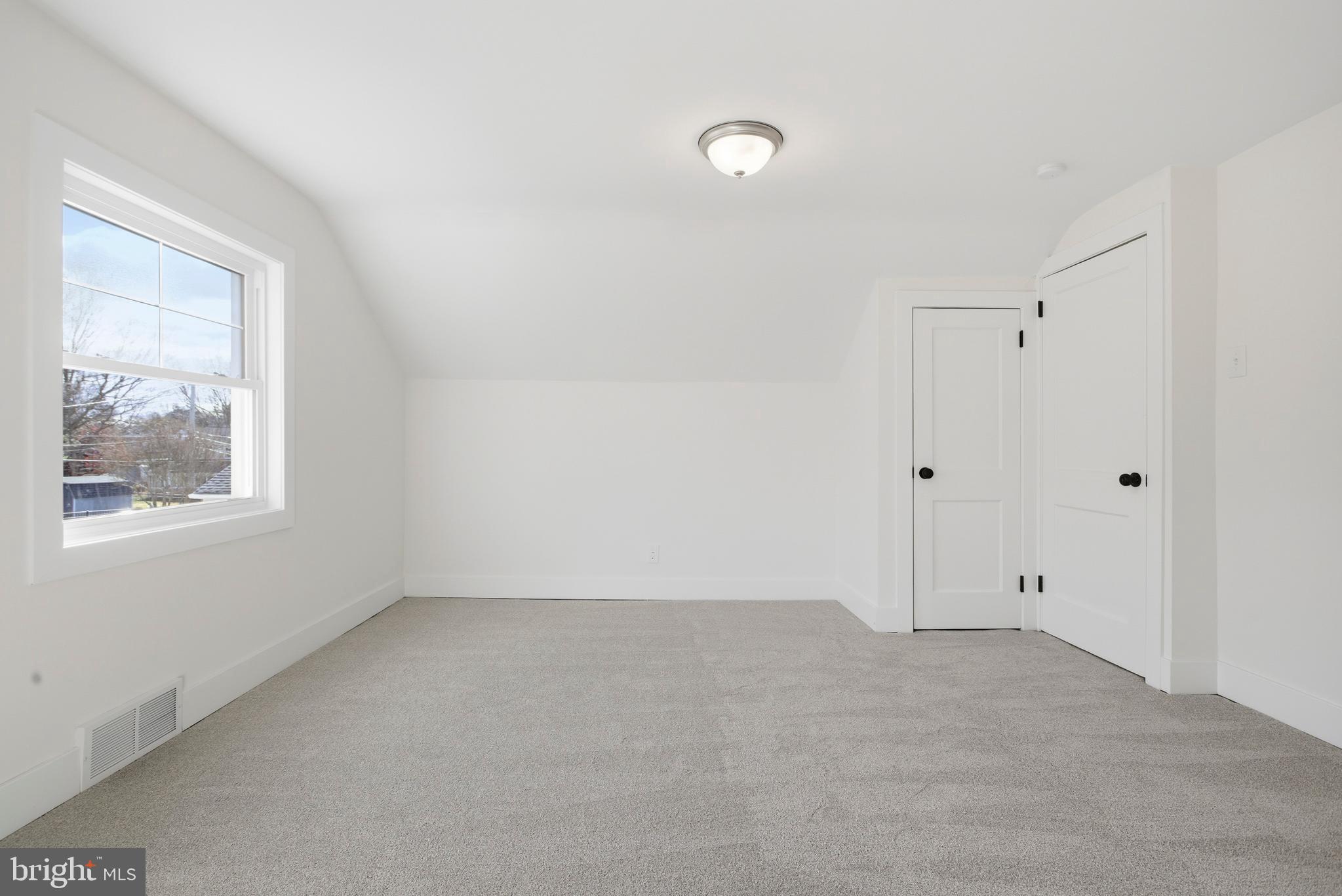 338 Wayne Avenue Springfield, PA 19064 - Photo 19 of 34 a view of an empty room with a window