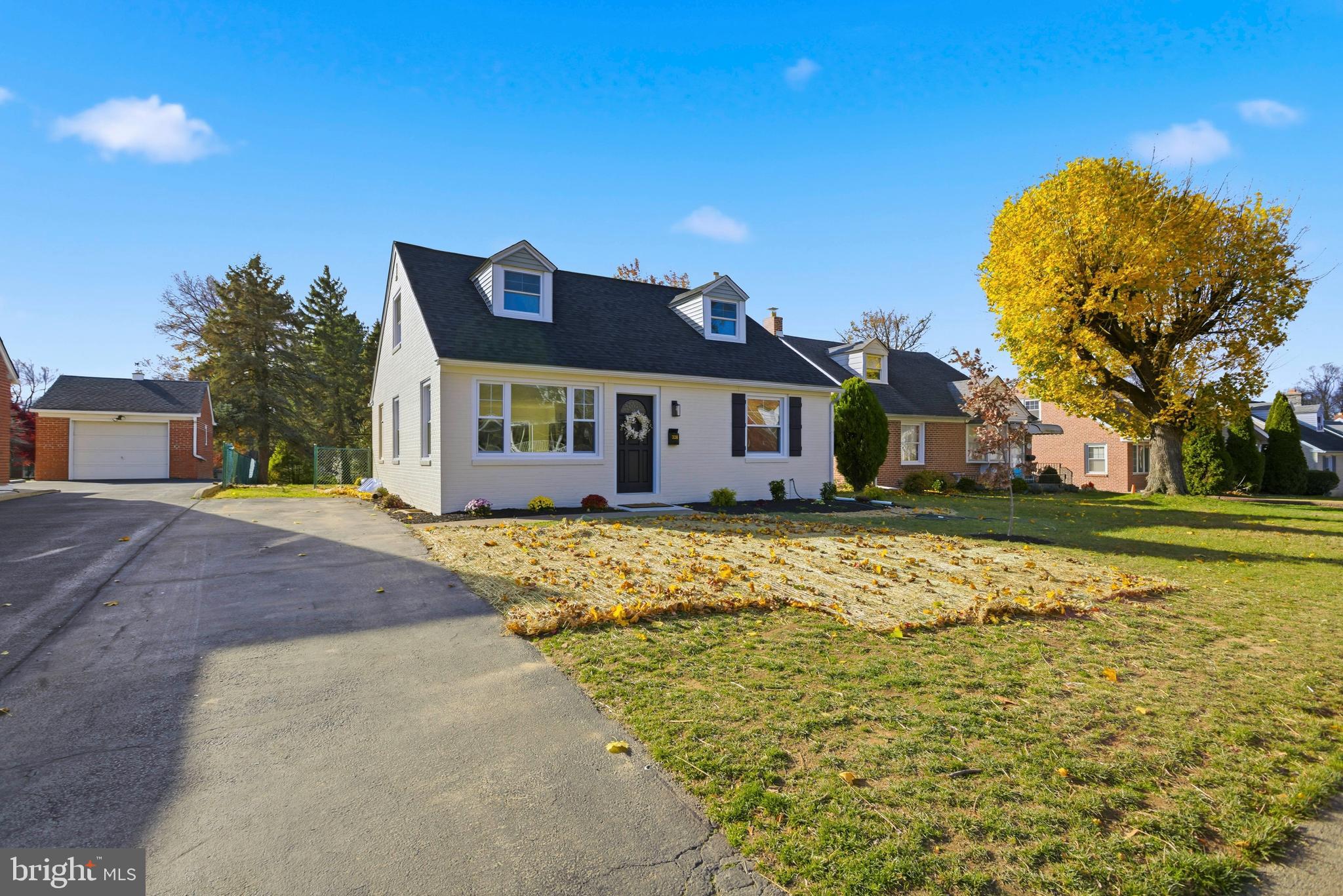 338 Wayne Avenue Springfield, PA 19064 - Photo 2 of 34 a front view of a house with a garden
