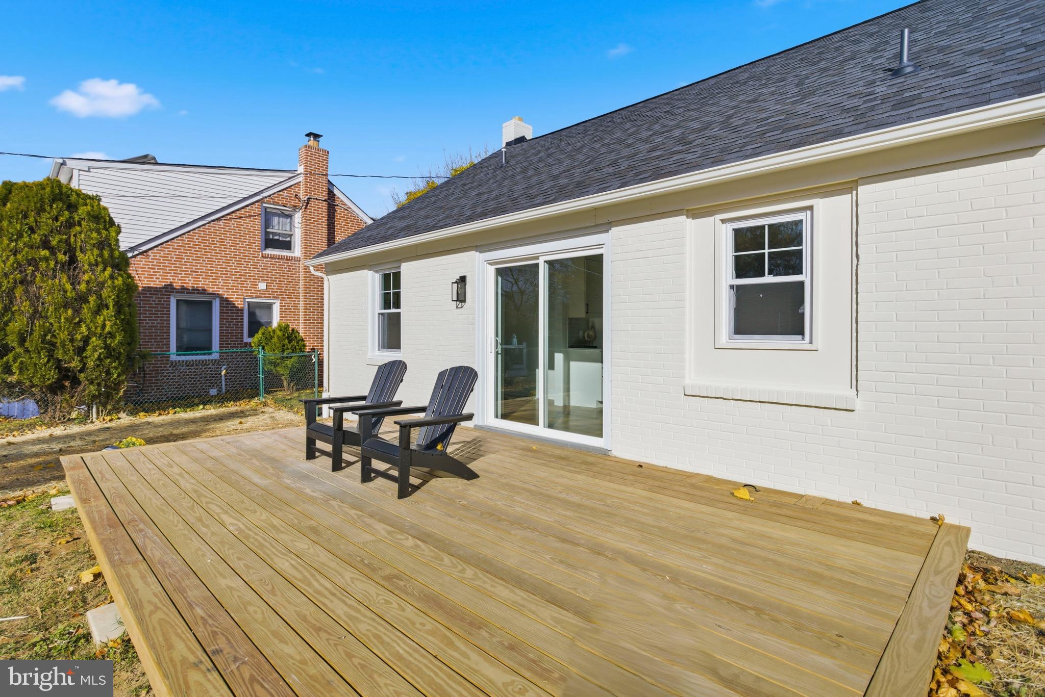 338 Wayne Avenue Springfield, PA 19064 - Photo 32 of 34 a roof deck with table and chairs and potted plants