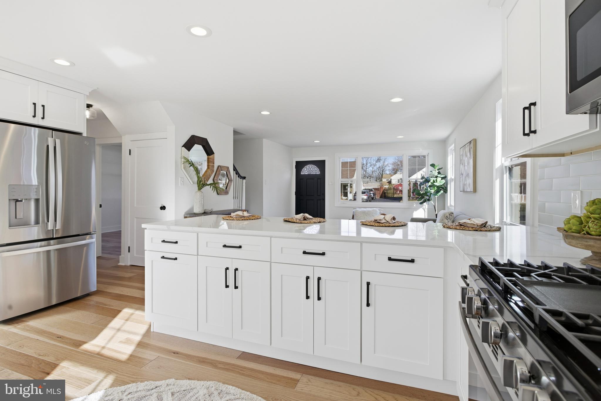 338 Wayne Avenue Springfield, PA 19064 - Photo 10 of 34 a kitchen with stainless steel appliances a sink stove and refrigerator