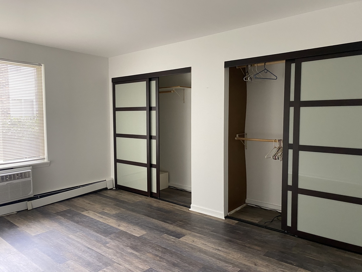 2600 Light Road, Unit 107 Oswego, IL 60543 - Photo 4 of 8 an empty room with wooden floor and a window