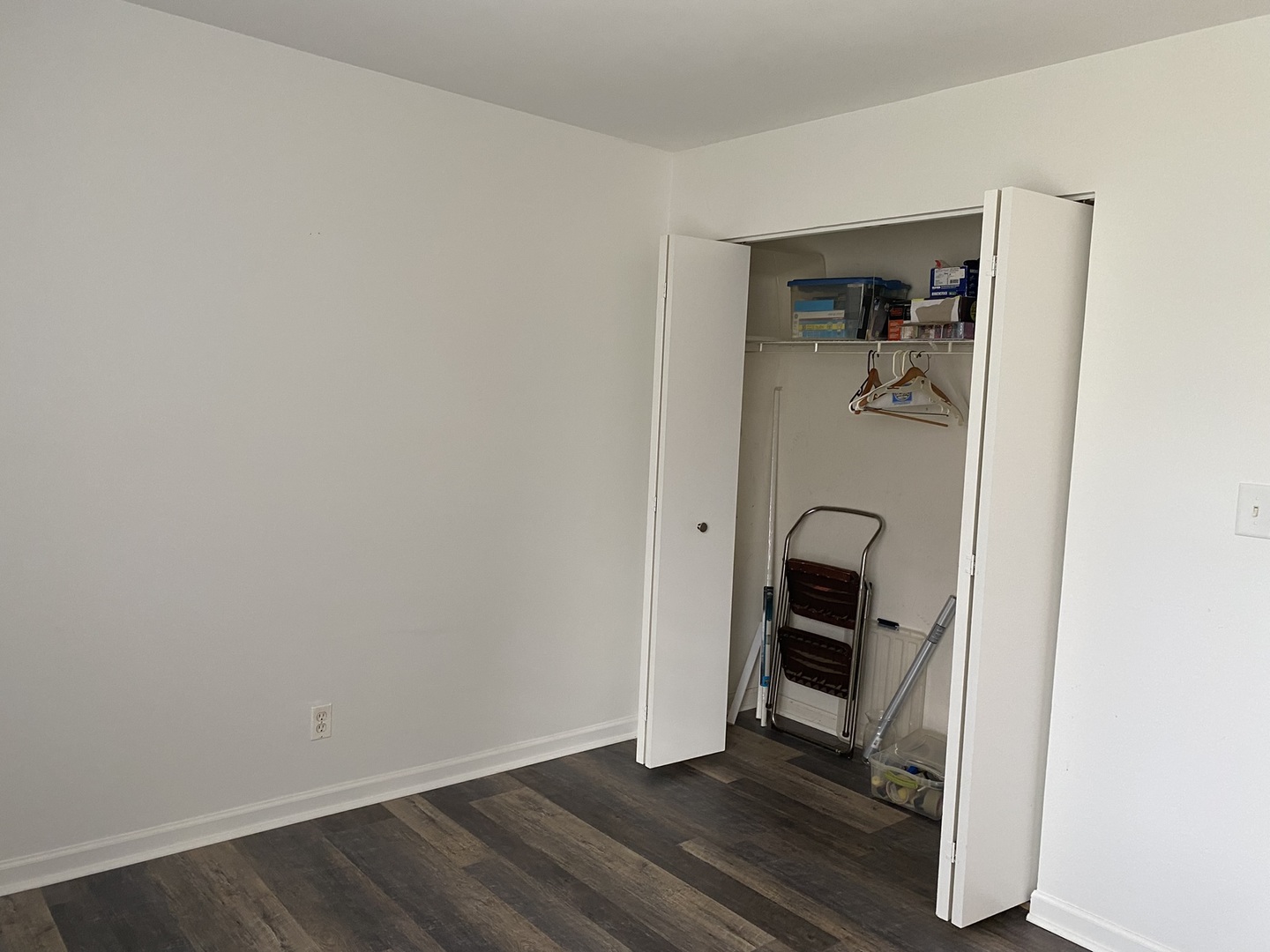 2600 Light Road, Unit 107 Oswego, IL 60543 - Photo 7 of 8 a view of an empty room with wooden floor and a window
