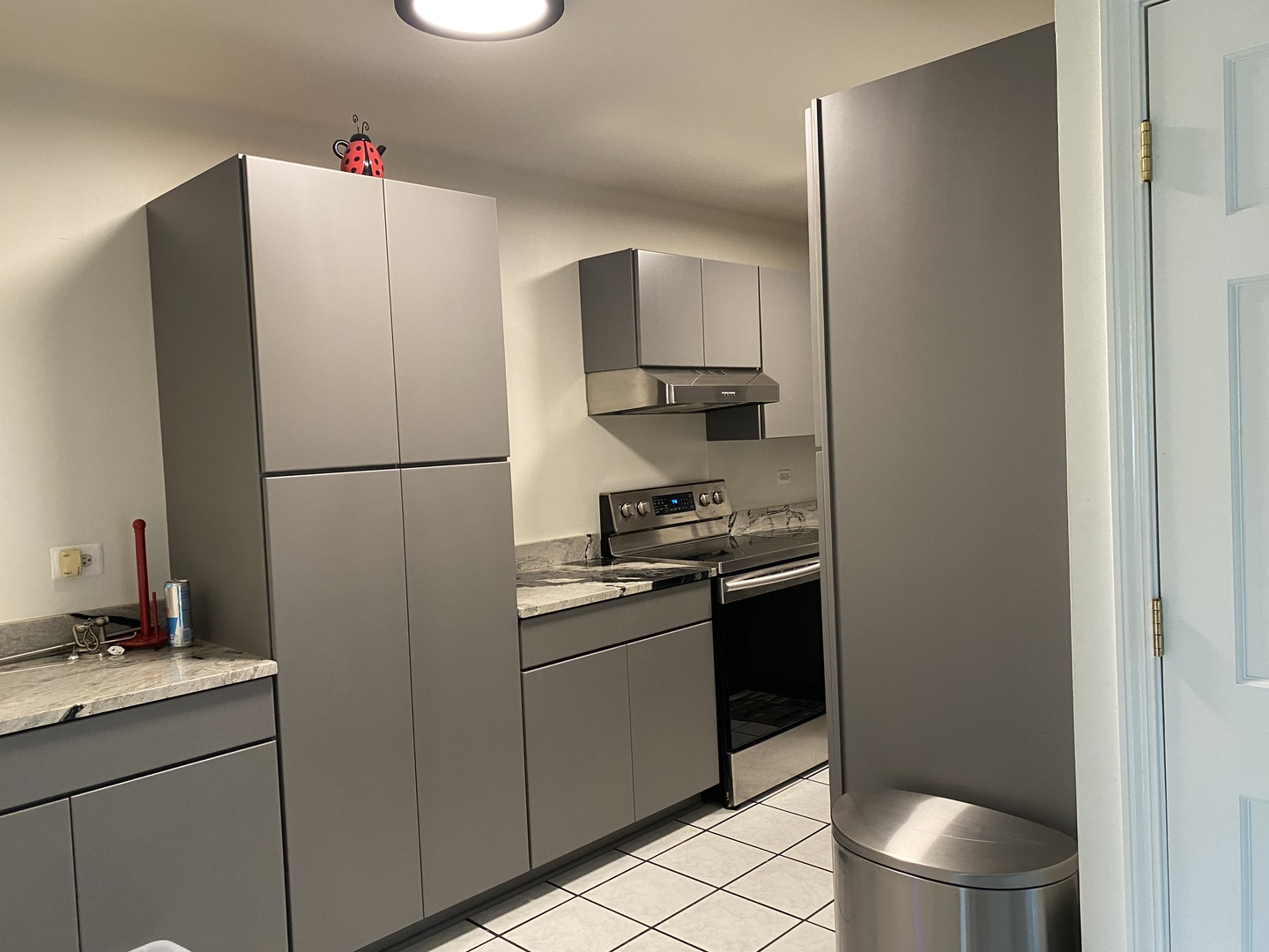 2600 Light Road, Unit 107 Oswego, IL 60543 - Photo 8 of 8 a kitchen with a refrigerator and a sink