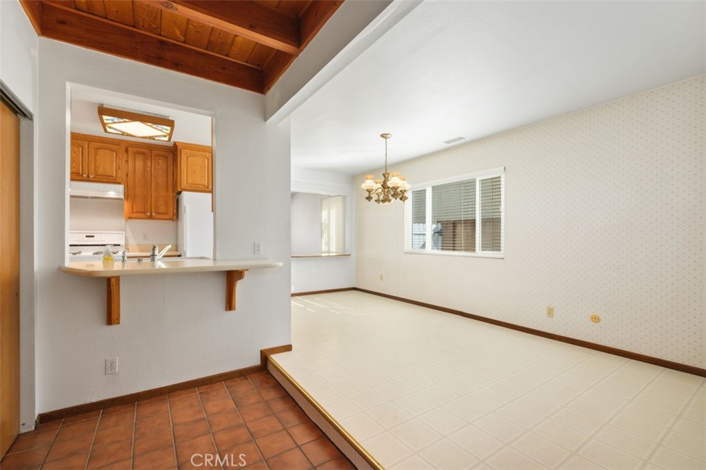 10221 Macduff Street Stanton, CA 90680 - Photo 11 of 31 a view of a kitchen with wooden floor and a window