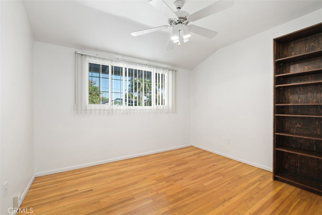10221 Macduff Street Stanton, CA 90680 - Photo 19 of 31 a view of empty room with wooden floor and fan
