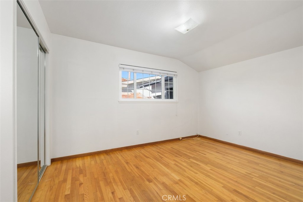 10221 Macduff Street Stanton, CA 90680 - Photo 20 of 31 a view of empty room with wooden floor and fan
