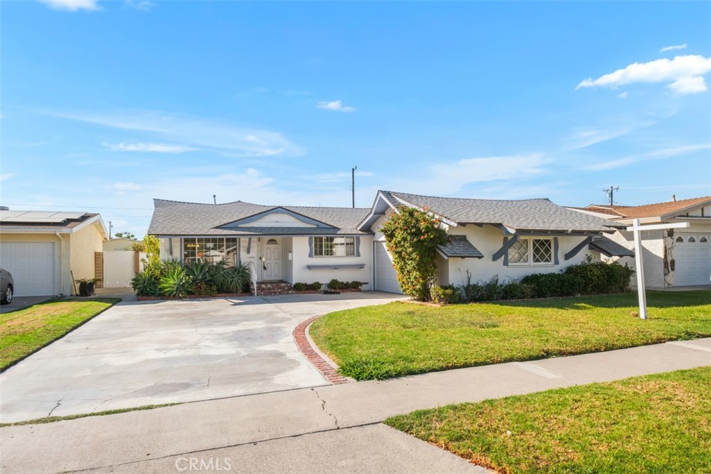 10221 Macduff Street Stanton, CA 90680 - Photo 2 of 31 a front view of a house with a yard
