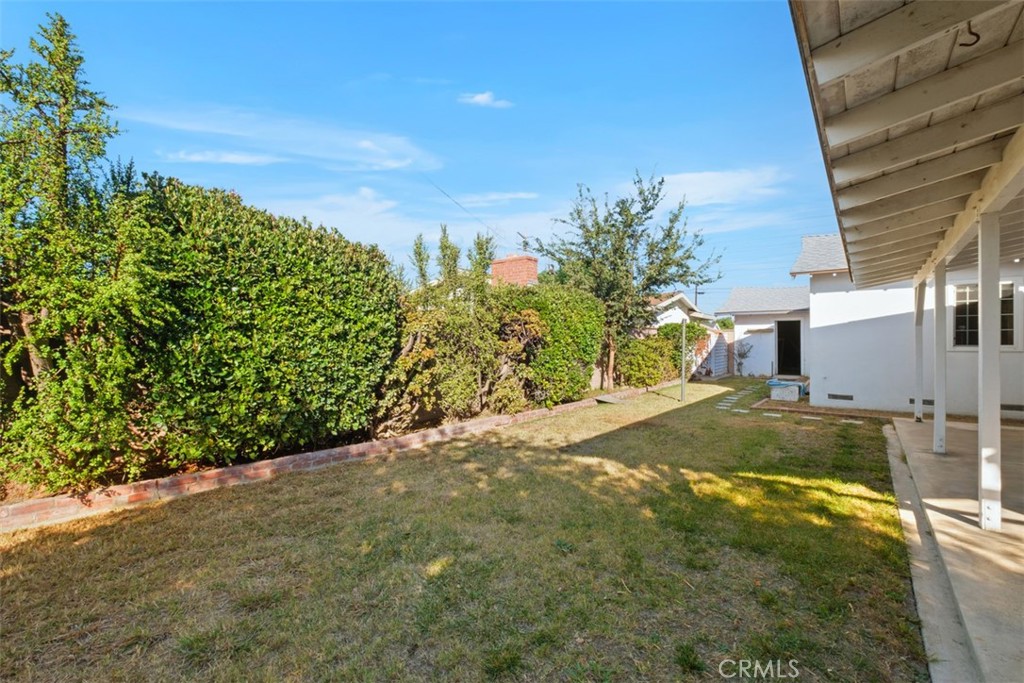 10221 Macduff Street Stanton, CA 90680 - Photo 27 of 31 a view of a yard with plants and trees