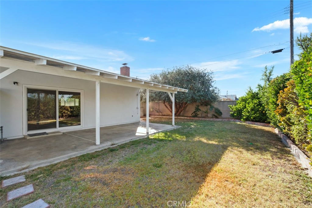 10221 Macduff Street Stanton, CA 90680 - Photo 29 of 31 front view of a house with a yard