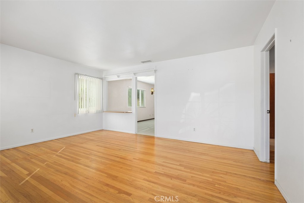 10221 Macduff Street Stanton, CA 90680 - Photo 5 of 31 a view of empty room with wooden floor
