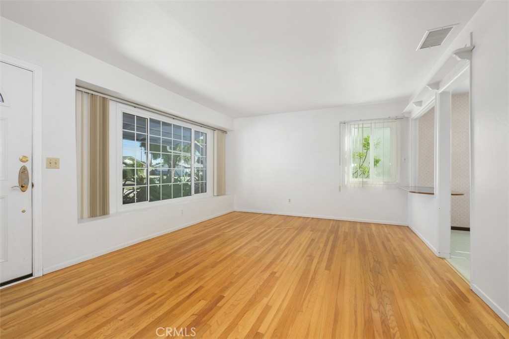 10221 Macduff Street Stanton, CA 90680 - Photo 6 of 31 wooden floor in an empty room with a window