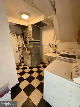 a storage room with a black white checkered floor with a black white checkered floor