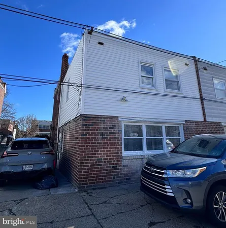 a car parked in front of a house