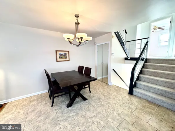 a view of a livingroom with furniture and a table