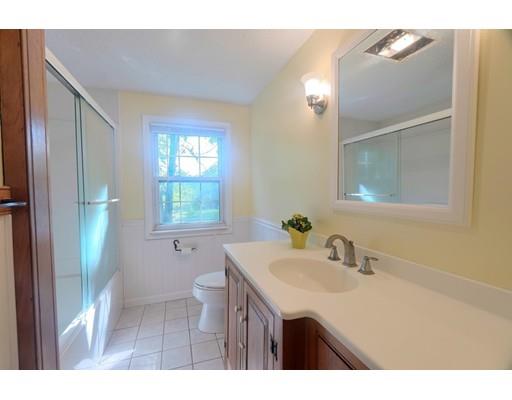 83 Lincoln Road Sutton, MA 01590 - Photo 12 of 22 a bathroom with a sink a toilet and a mirror