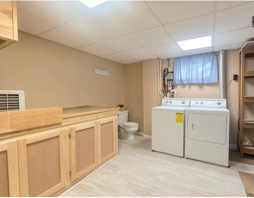 83 Lincoln Road Sutton, MA 01590 - Photo 17 of 22 a utility room with cabinets washer and dryer