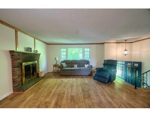 83 Lincoln Road Sutton, MA 01590 - Photo 5 of 22 a living room with furniture and a fireplace