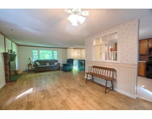 83 Lincoln Road Sutton, MA 01590 - Photo 6 of 22 a living room with furniture and a wooden floor