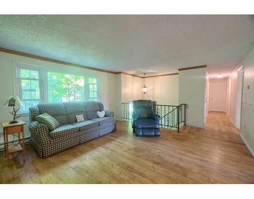 83 Lincoln Road Sutton, MA 01590 - Photo 9 of 22 a living room with furniture and a wooden floor