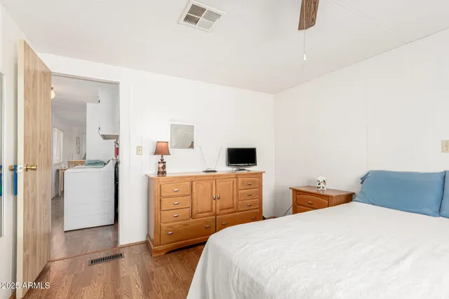 a bedroom with a bed and a table