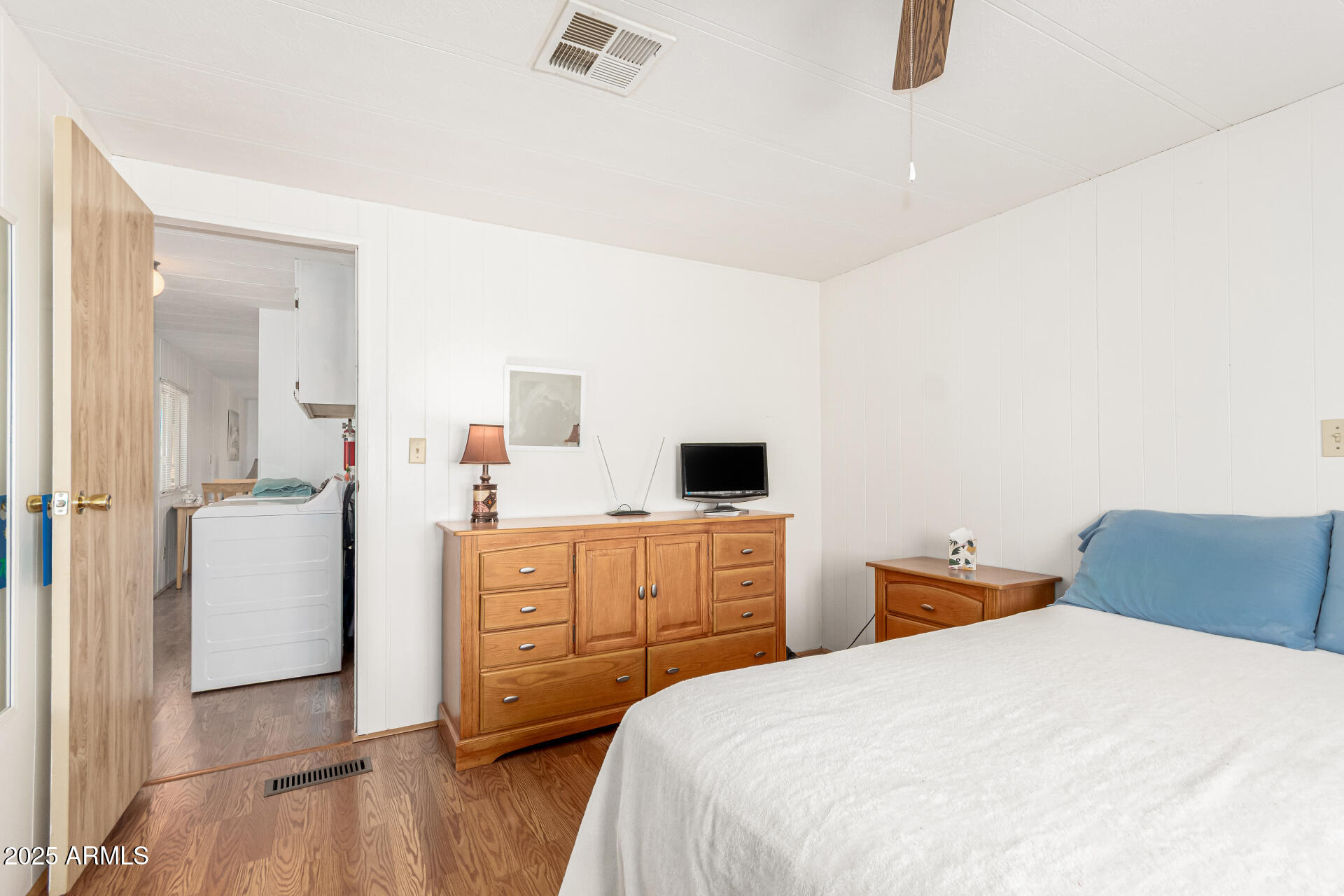 53 North Mountain Road, Unit 19 Apache Junction, AZ 85120 - Photo 11 of 21 a bedroom with a bed and wooden floor