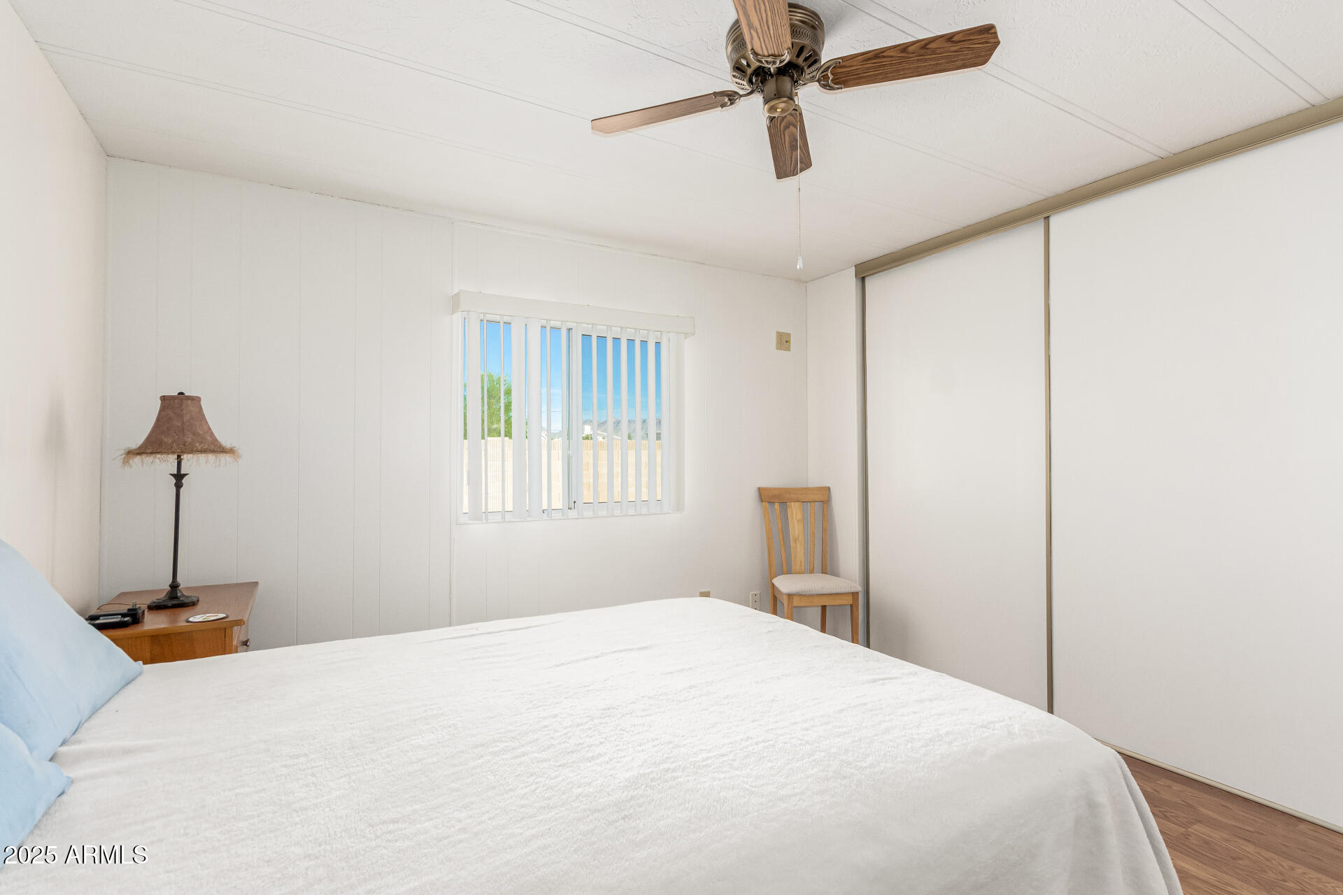 53 North Mountain Road, Unit 19 Apache Junction, AZ 85120 - Photo 13 of 21 a bedroom with a bed and a chandelier