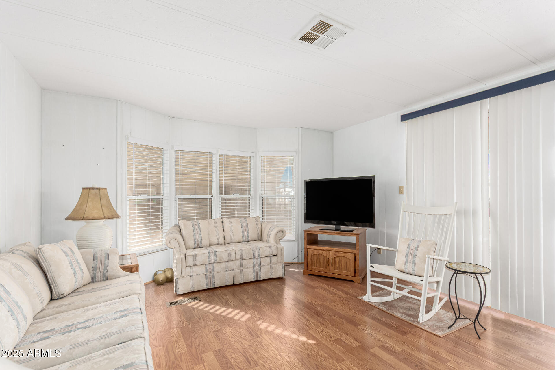 53 North Mountain Road, Unit 19 Apache Junction, AZ 85120 - Photo 2 of 21 a living room with furniture and a flat screen tv