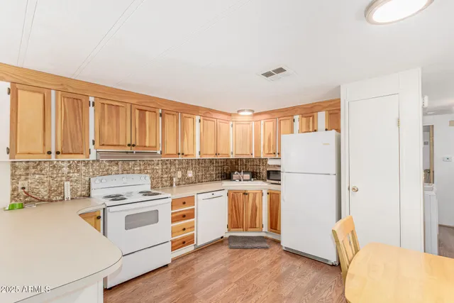 a kitchen with a stove a refrigerator and a stove