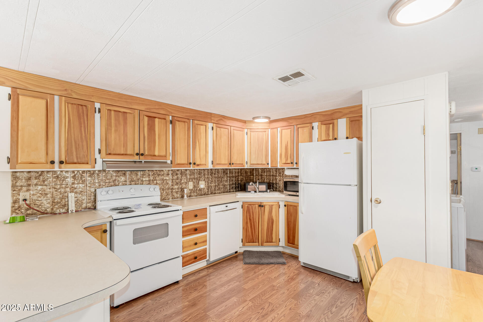53 North Mountain Road, Unit 19 Apache Junction, AZ 85120 - Photo 7 of 21 a kitchen with a stove a refrigerator and a stove