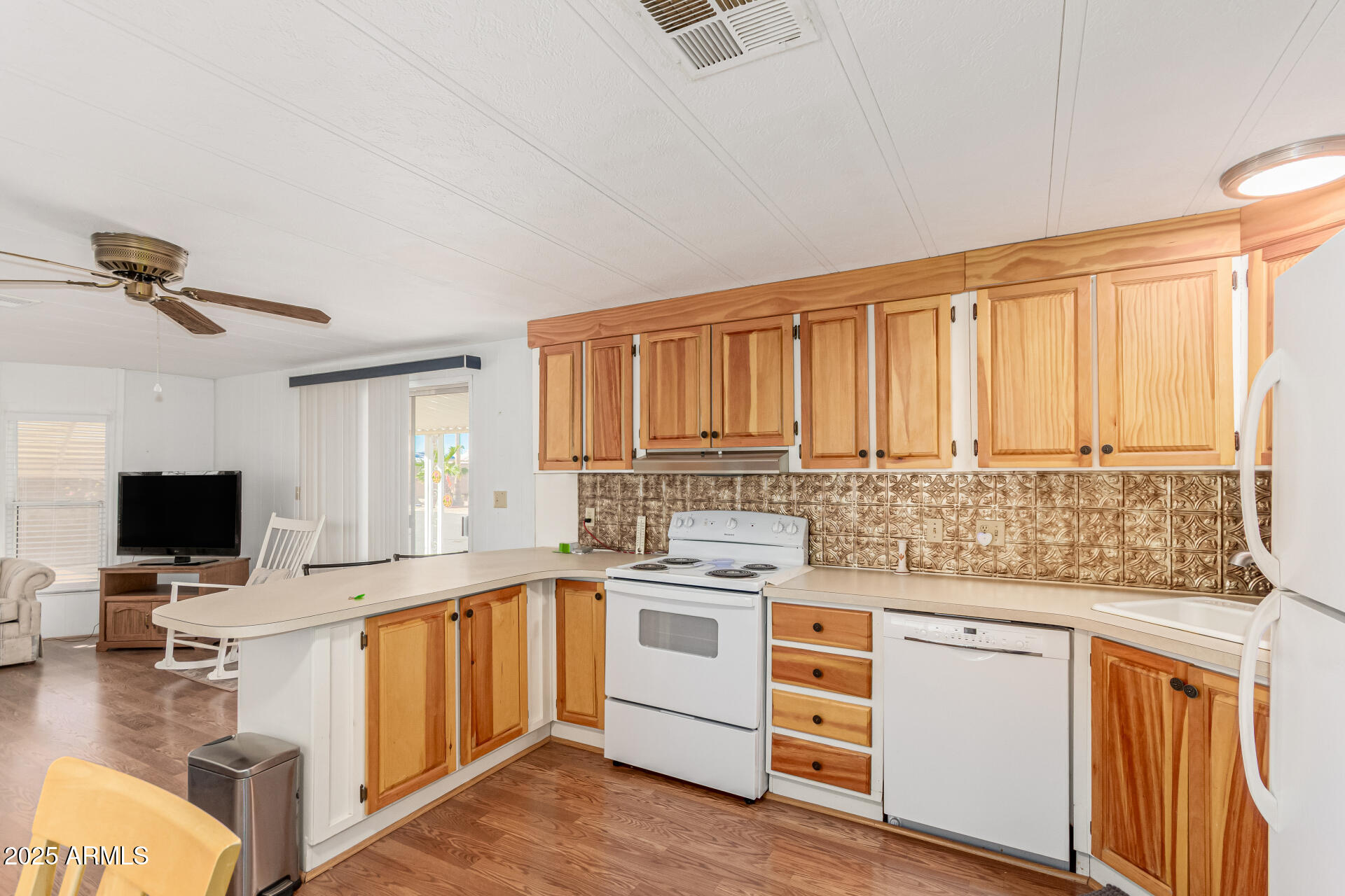 53 North Mountain Road, Unit 19 Apache Junction, AZ 85120 - Photo 10 of 21 a kitchen with a stove a sink and a microwave