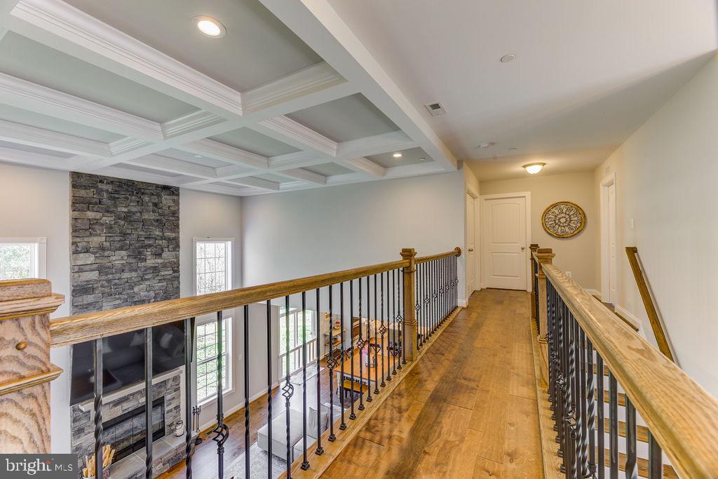 600 Ray Road Sunderland, MD 20689 - Photo 13 of 25 a view of a hallway with wooden floor and staircase