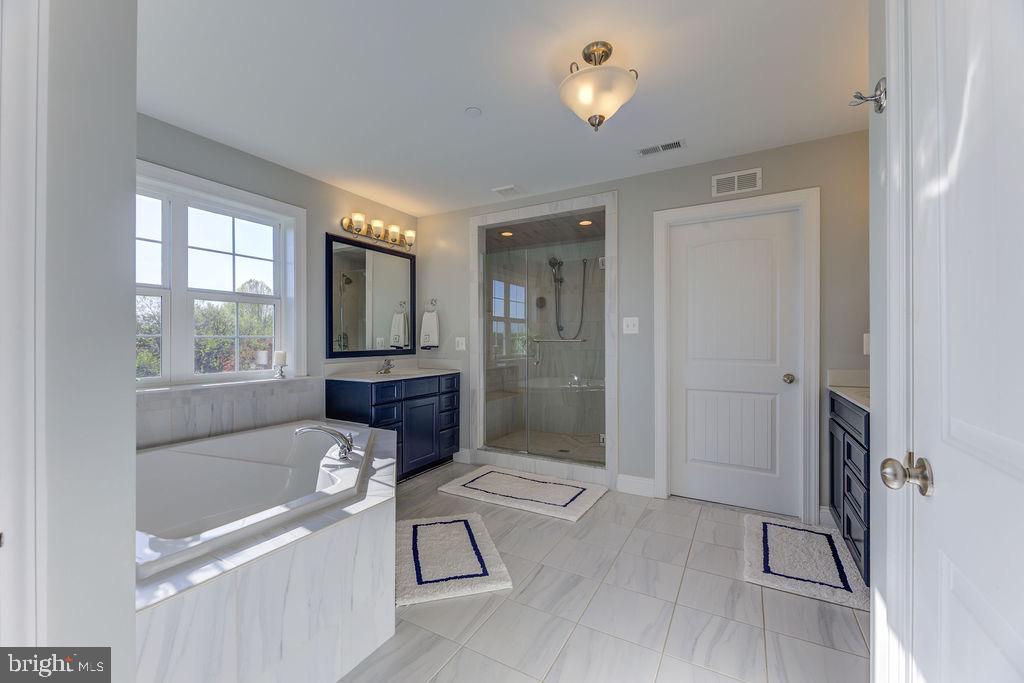 600 Ray Road Sunderland, MD 20689 - Photo 14 of 25 a bathroom with a bathtub and a shower
